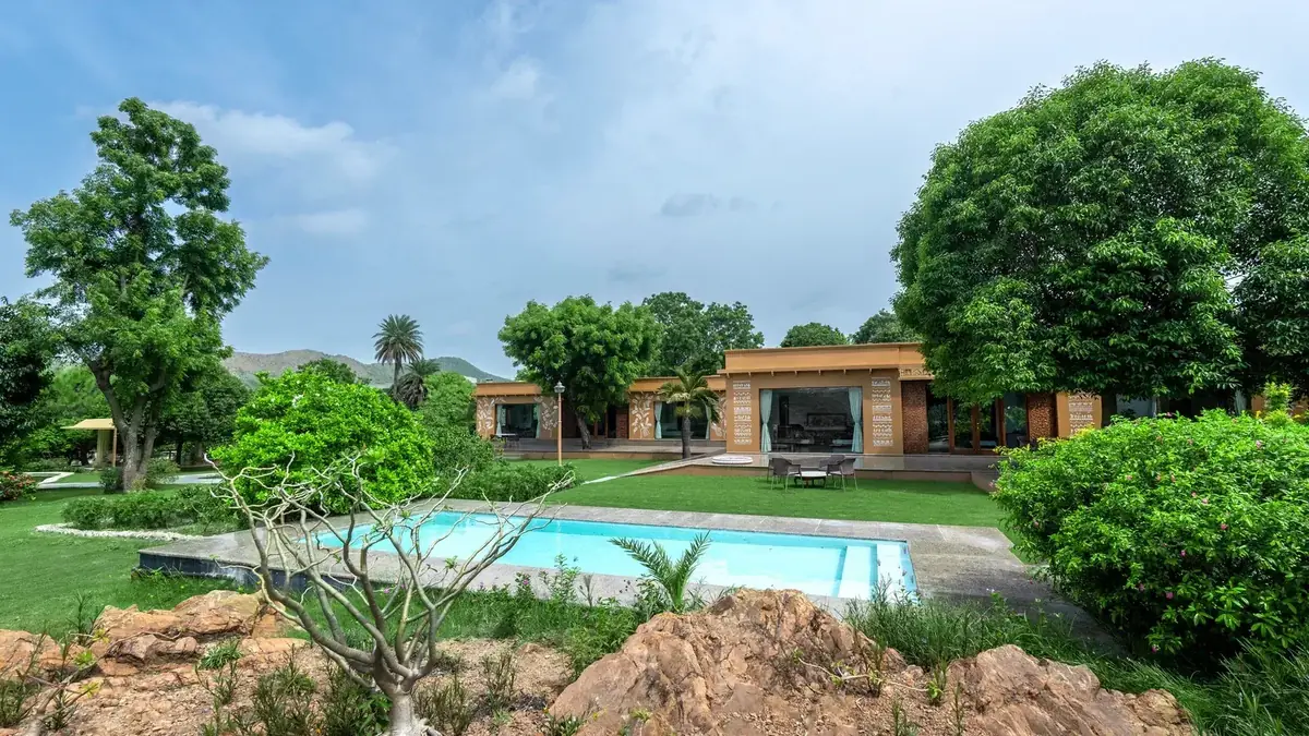 Landscaped family pool and lawns at YAAN Udaipur