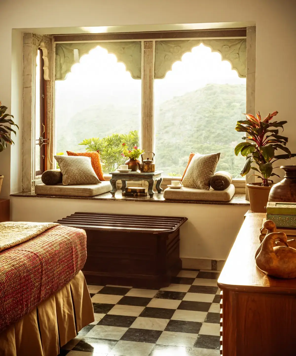 Heritage room with an arched picture window overlooking the Aravalli hills