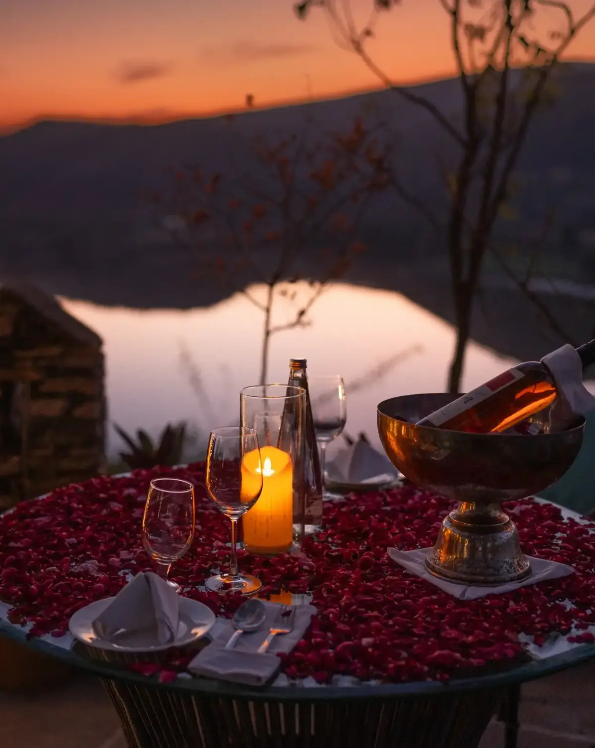 Private candlelit lakeside dinner at sunset at YAAN Udaipur
